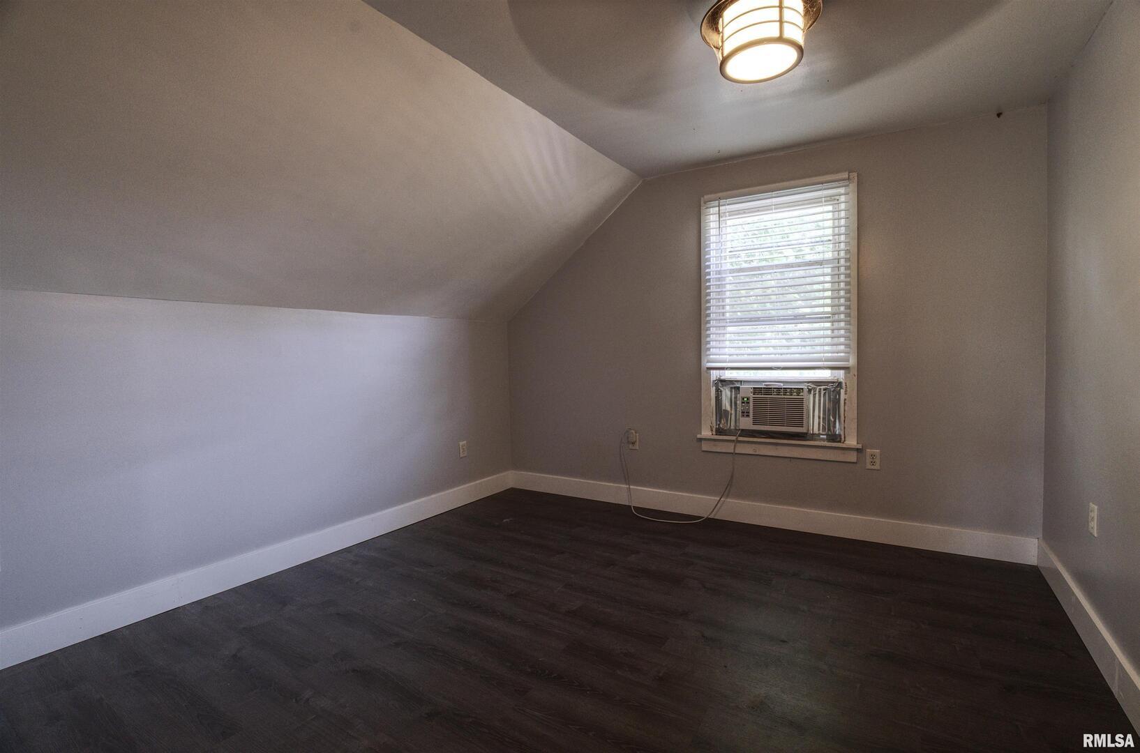 828 10th Avenue Fulton, IL 61252 - Photo 28 of 34 an empty room with wooden floor and windows