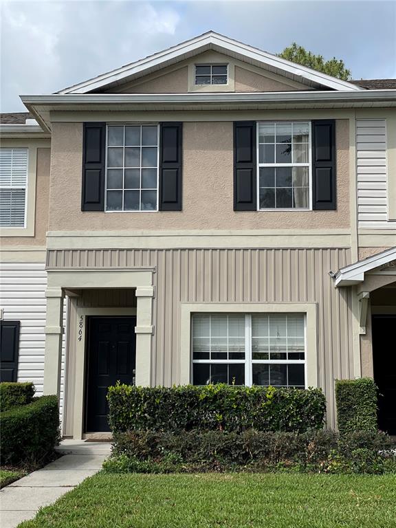 5864 Fishhawk Ridge Drive Lithia, FL 33547 - Photo 1 of 1 a front view of a house with garden