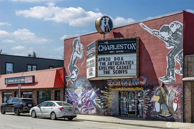 a bunch of street signs outside the stores
