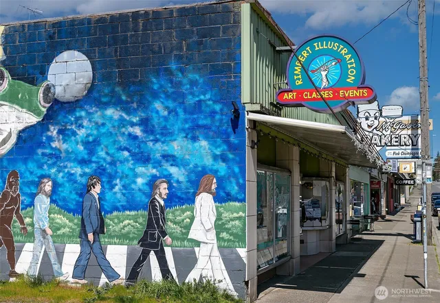 a view of a brick house with potted plants