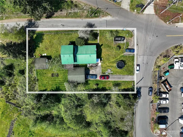 an aerial view of multiple houses with yard