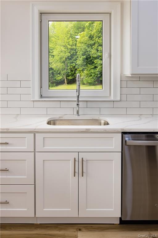 274 Reservoir Hill Road Norwich, NY 13815 - Photo 13 of 44 a view with cabinets a sink and dishwasher