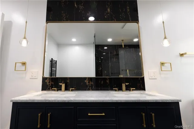 a bathroom with a shower and a sink