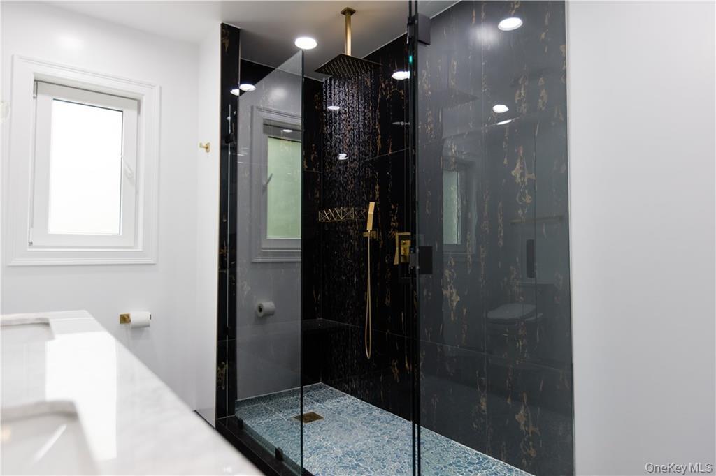 274 Reservoir Hill Road Norwich, NY 13815 - Photo 16 of 44 a bathroom with a shower and a sink