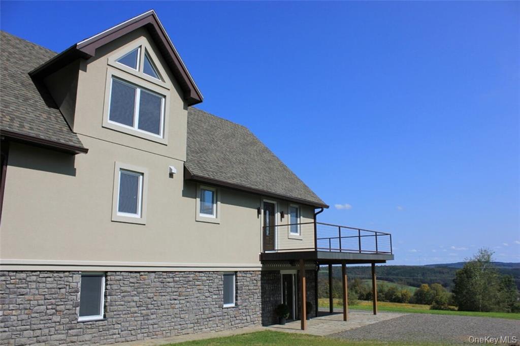 274 Reservoir Hill Road Norwich, NY 13815 - Photo 19 of 44 a front view of a house with a street