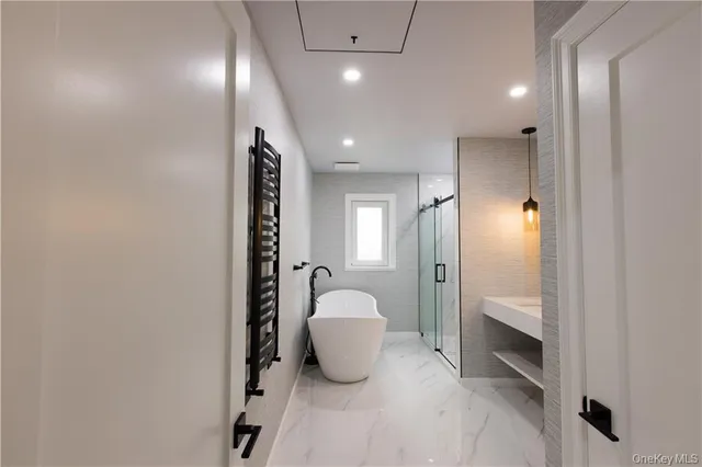 a bathroom with a shower and a sink