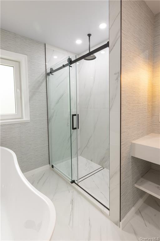 274 Reservoir Hill Road Norwich, NY 13815 - Photo 32 of 44 a bathroom with a shower and a sink