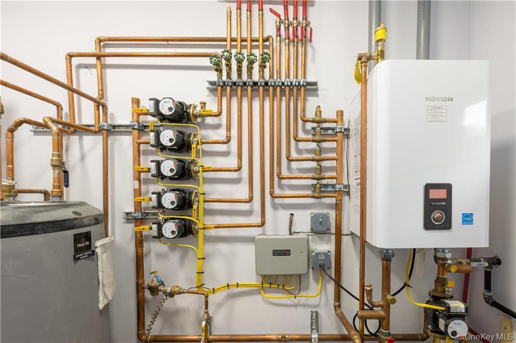 274 Reservoir Hill Road Norwich, NY 13815 - Photo 36 of 44 walk in closet with window and refrigerator