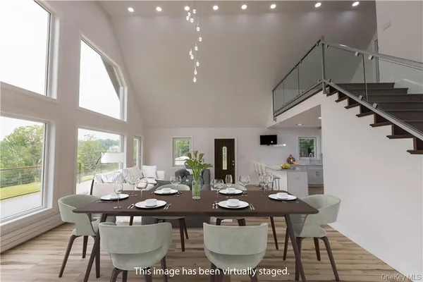 a view of a dining room with furniture window and outside view