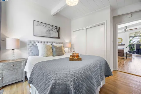 a view of a patio with table and chairs potted plants and wooden fence