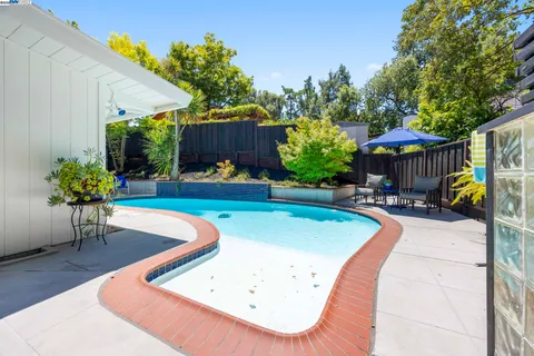 a backyard of a house with seating space