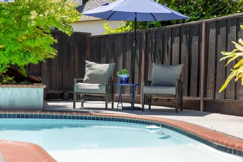 a front view of a house with a yard and a garage
