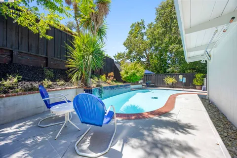 a view of a swimming pool with a patio