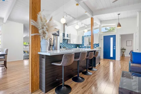 a view of a kitchen and dining room