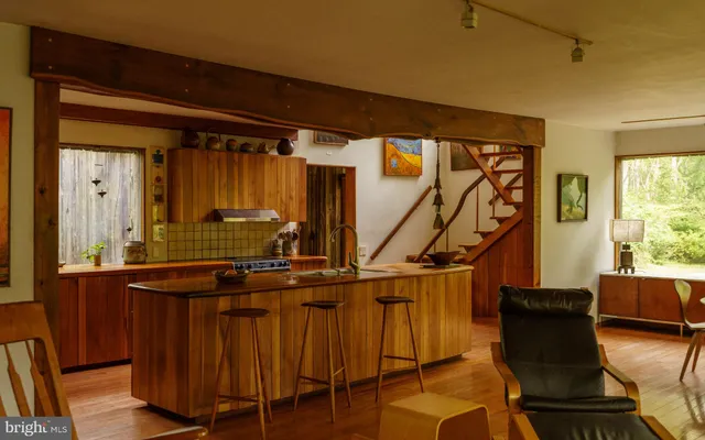 a view of a living room with a floor to ceiling window and floor to ceiling window