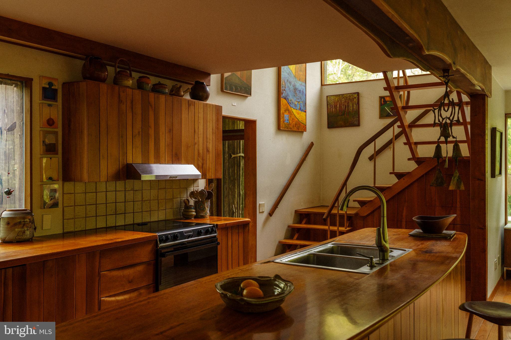 36 Rabbit Run Road Malvern, PA 19355 - Photo 14 of 86 a kitchen with granite countertop a sink a stove and a wooden cabinets