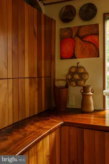 a view of entryway with a large window and wooden floor