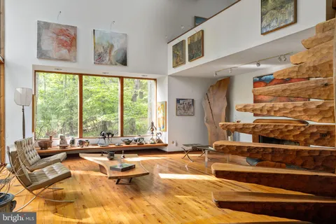 a view of staircase with white walls and a window