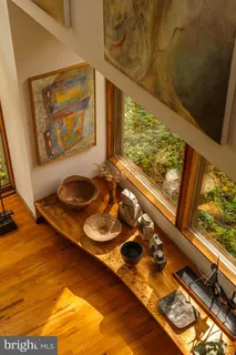 a bathroom with a tub and large window