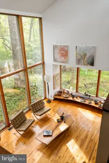 a view of staircase with white walls and a window