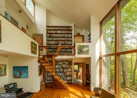 a view of a chairs and bench on the wall