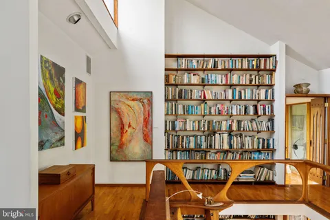 a view of a city with lush green forest
