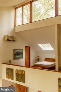 a view of entryway with wooden floor and front door