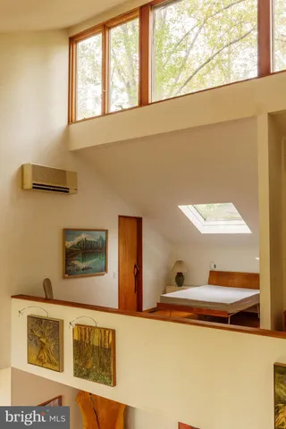 a view of entryway with wooden floor and front door