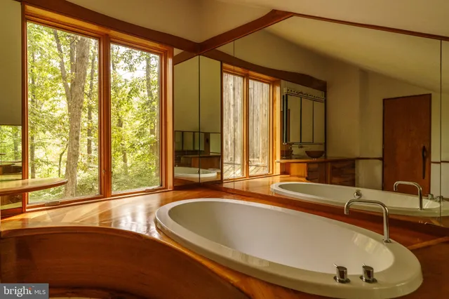 a view of a room with furniture and a window