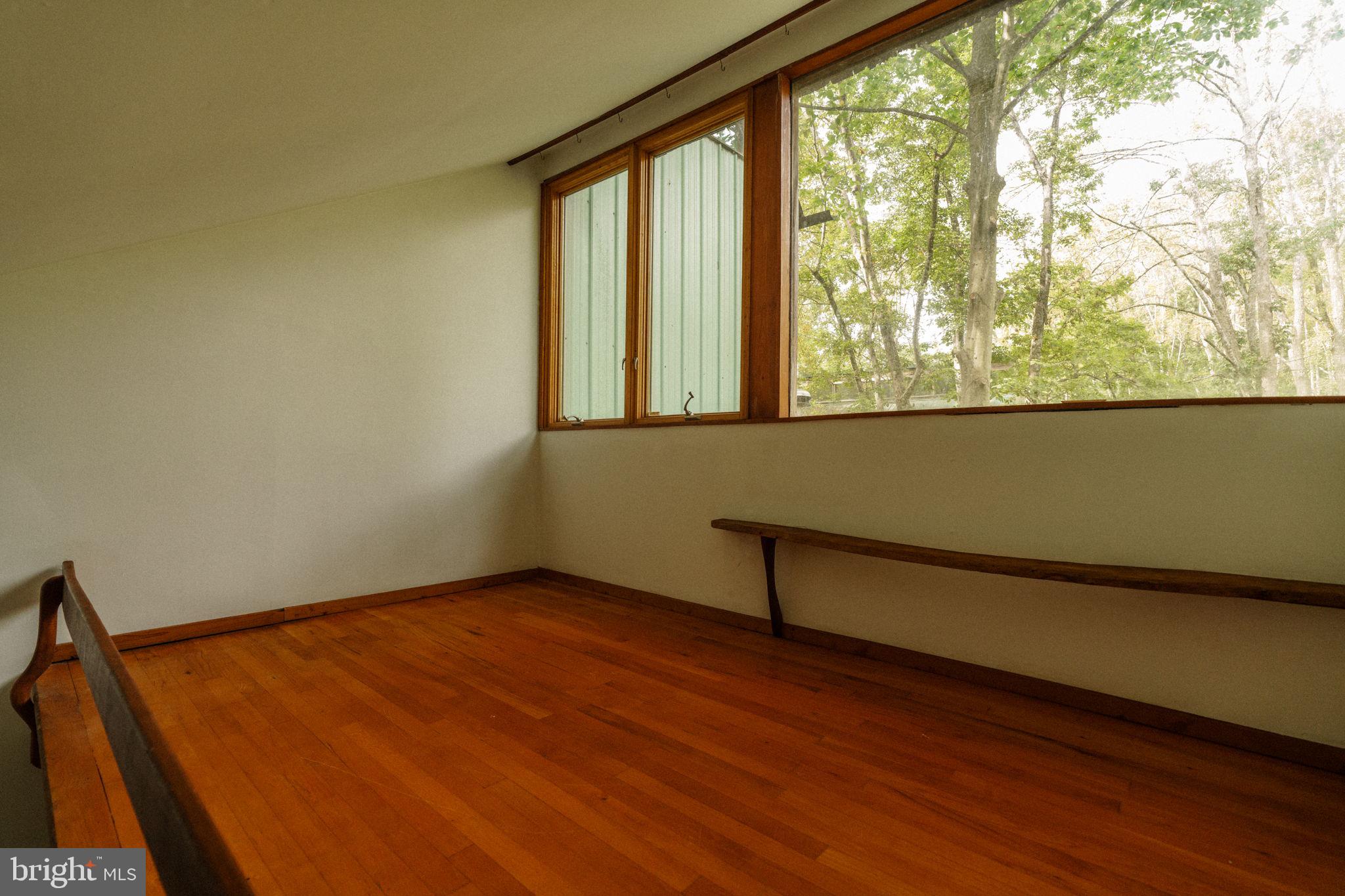36 Rabbit Run Road Malvern, PA 19355 - Photo 53 of 86 an empty room with wooden floor and windows