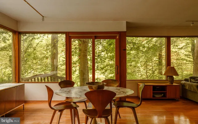 a kitchen with granite countertop a sink a stove and a wooden cabinets