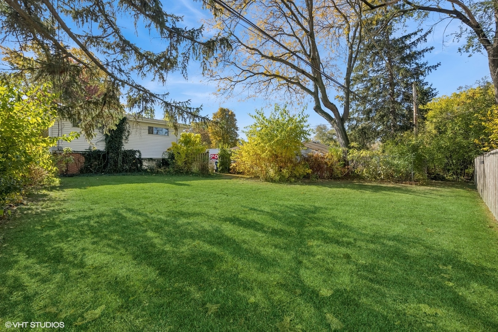 1521 Lakeside Drive Wheaton, IL 60187 - Photo 15 of 17 a view of a yard with plants and trees