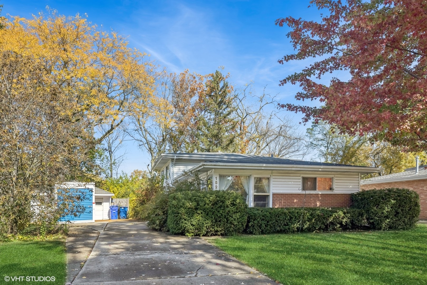 1521 Lakeside Drive Wheaton, IL 60187 - Photo 17 of 17 a front view of a house with garden