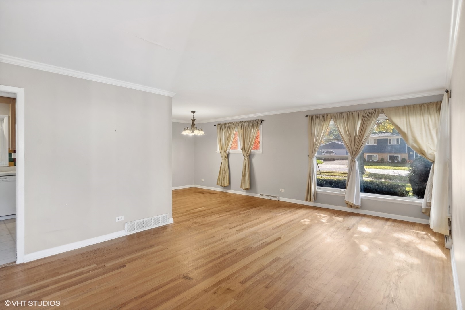 1521 Lakeside Drive Wheaton, IL 60187 - Photo 2 of 17 a view of an empty room with a window and wooden floor
