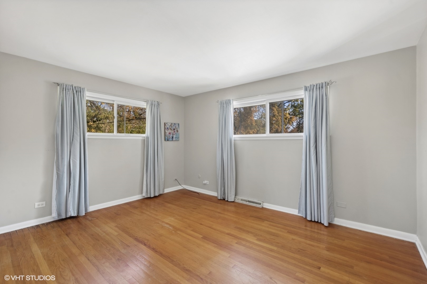 1521 Lakeside Drive Wheaton, IL 60187 - Photo 7 of 17 an empty room with wooden floor and windows
