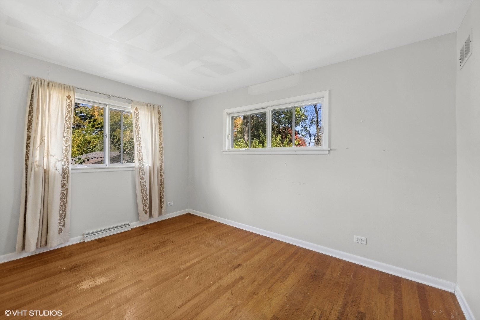 1521 Lakeside Drive Wheaton, IL 60187 - Photo 8 of 17 wooden floor in an empty room with a window