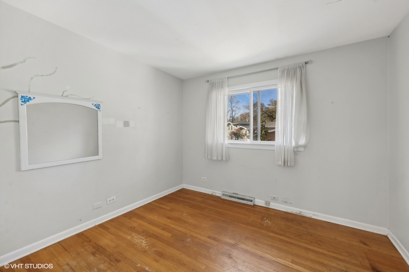 1521 Lakeside Drive Wheaton, IL 60187 - Photo 9 of 17 a view of a room with wooden floor and white walls