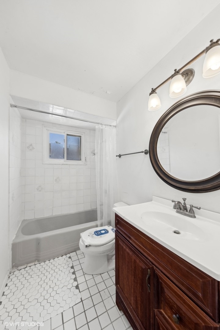 1521 Lakeside Drive Wheaton, IL 60187 - Photo 10 of 17 a bathroom with a sink mirror vanity and toilet