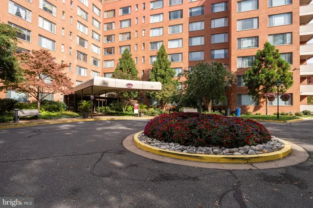 a view of a building with a yard