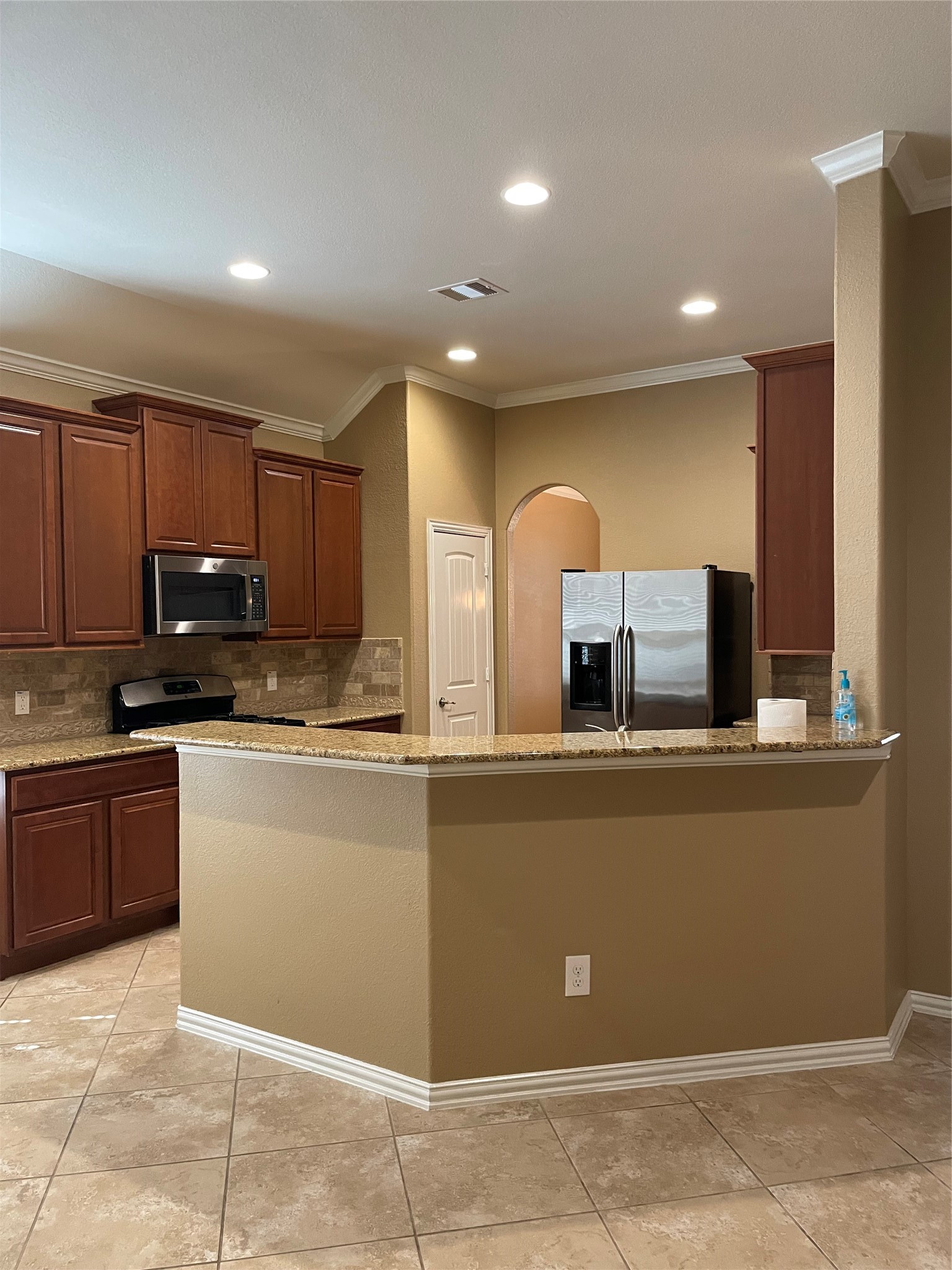 19518 Country Ranch Court Spring, TX 77388 - Photo 4 of 10 a kitchen with stainless steel appliances granite countertop a refrigerator and a stove top oven