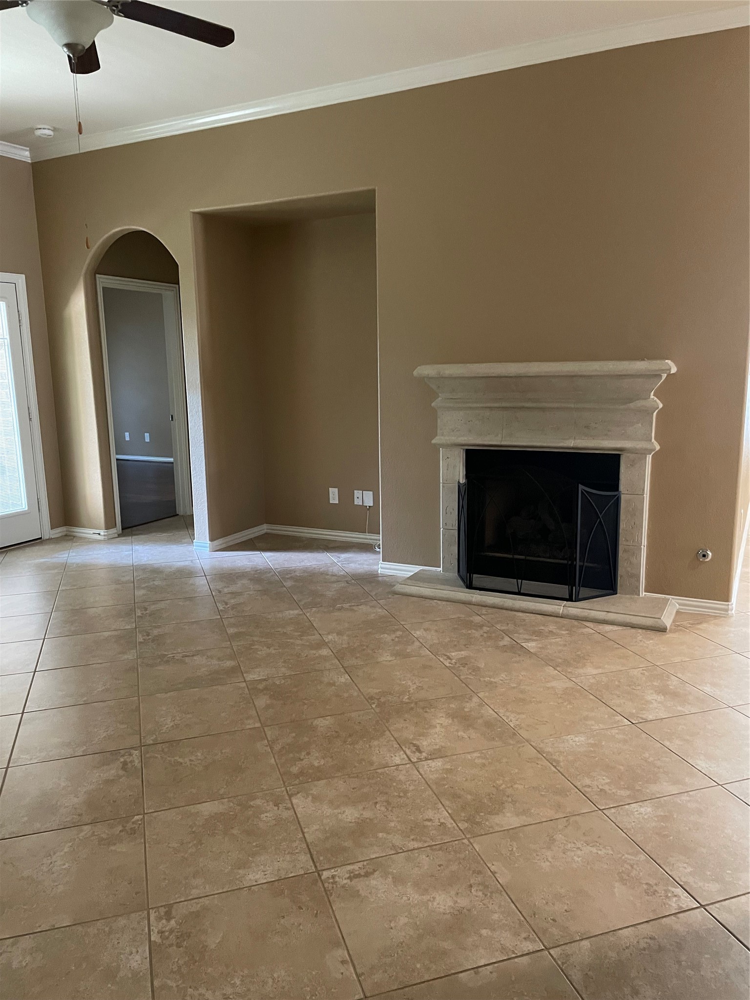 19518 Country Ranch Court Spring, TX 77388 - Photo 6 of 10 an empty room with fireplace and fan