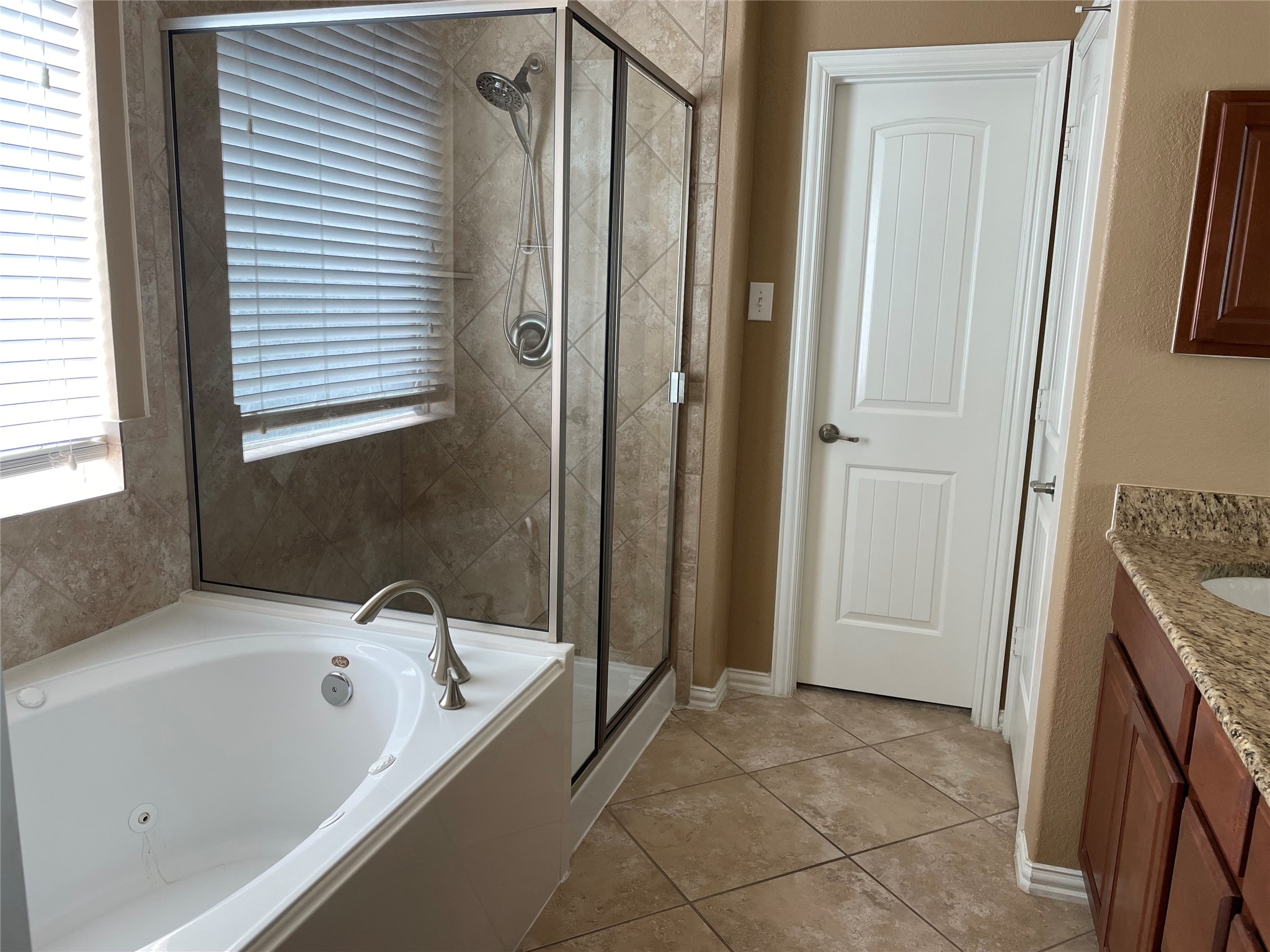 19518 Country Ranch Court Spring, TX 77388 - Photo 9 of 10 a bathroom with a tub a sink and a shower