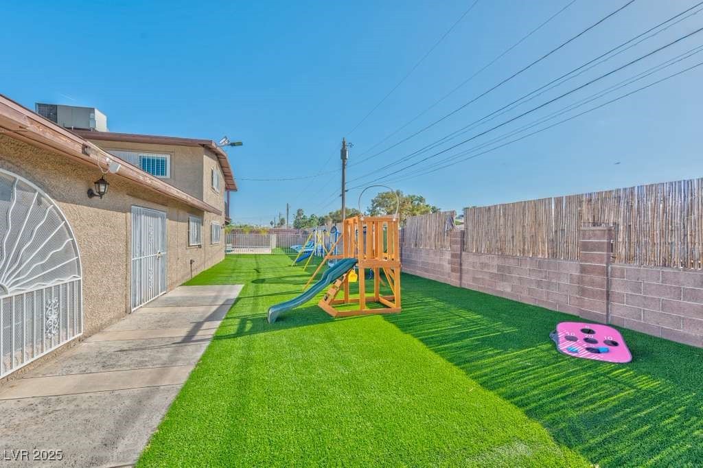 4990 Philmar Avenue Las Vegas, NV 89120 - Photo 17 of 32 Fenced backyard with a playground