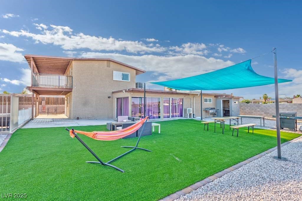 4990 Philmar Avenue Las Vegas, NV 89120 - Photo 19 of 32 Rear view of house with a patio area and a balcony