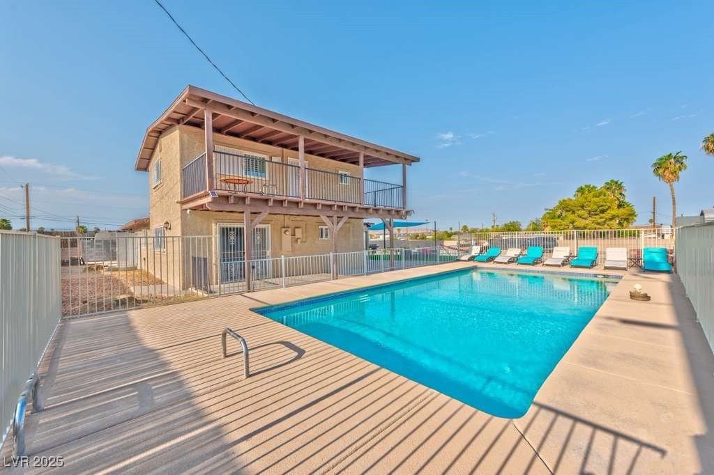 4990 Philmar Avenue Las Vegas, NV 89120 - Photo 22 of 32 View of swimming pool featuring a patio and a deck