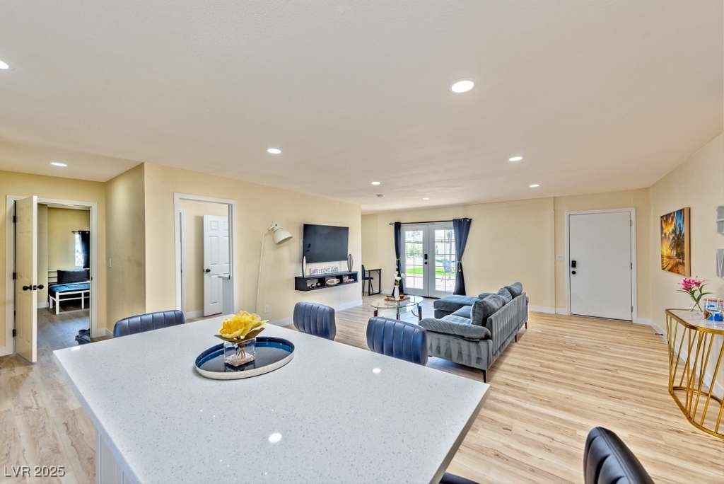 4990 Philmar Avenue Las Vegas, NV 89120 - Photo 29 of 32 Dining area featuring recessed lighting, light wood-type flooring, and french doors