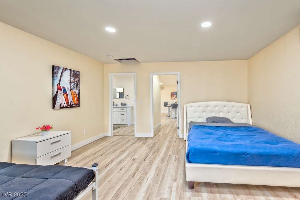 4990 Philmar Avenue Las Vegas, NV 89120 - Photo 31 of 32 Bedroom with recessed lighting and light wood-style flooring