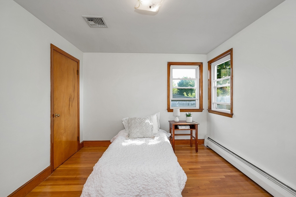 7 Marie Street Methuen, MA 01844 - Photo 16 of 39 a bedroom with a bed and wooden floor