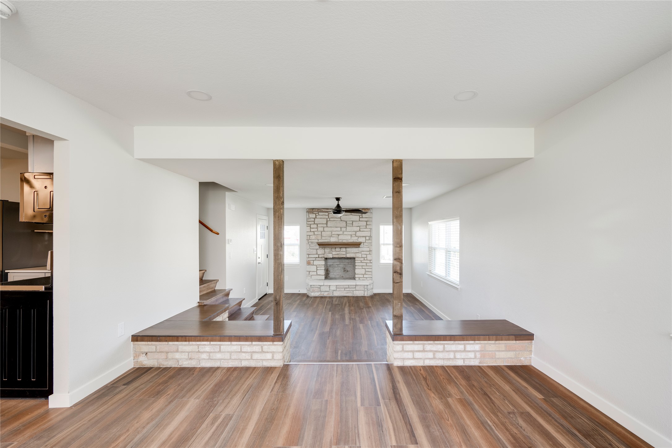 809 North West Street Burnet, TX 78611 - Photo 11 of 40 a view of a living room a wooden floor and a fireplace