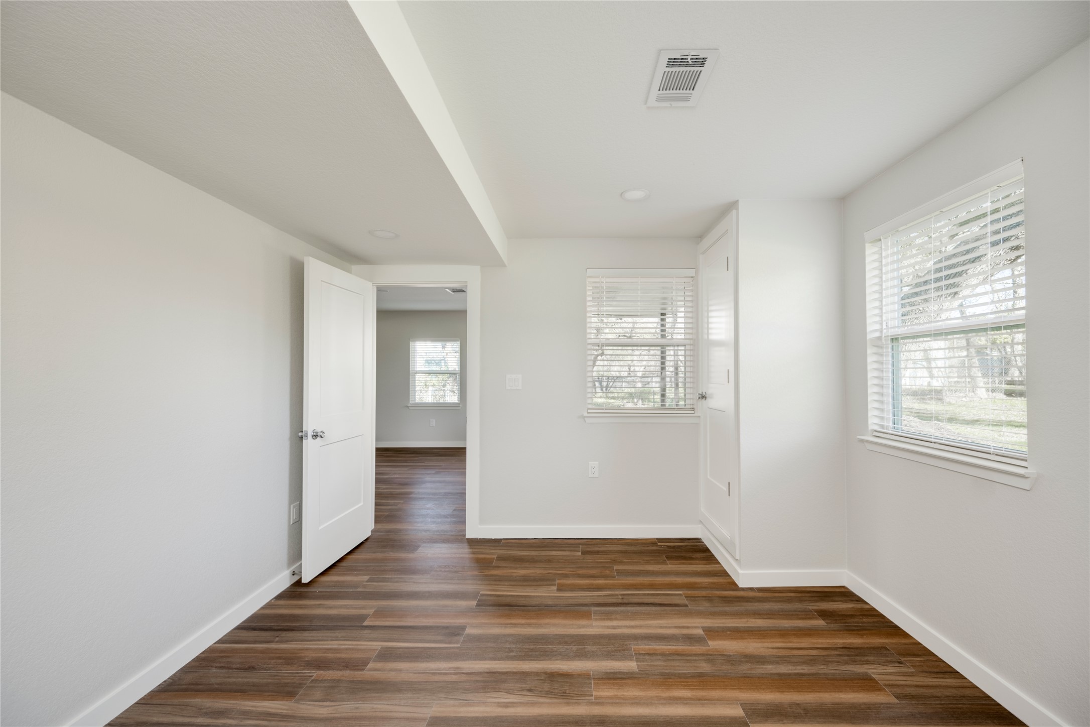 809 North West Street Burnet, TX 78611 - Photo 15 of 40 a view of an empty room with wooden floor and a window